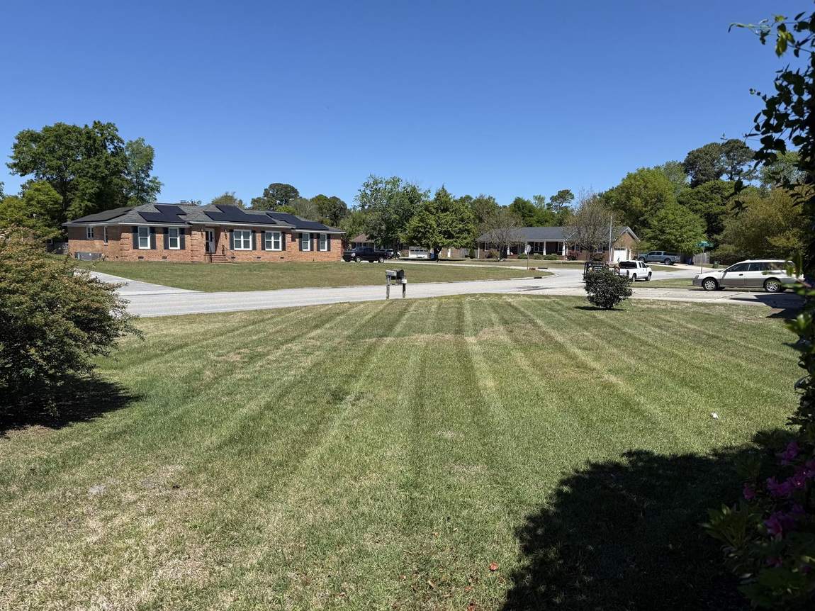 Wide manicured front lawn