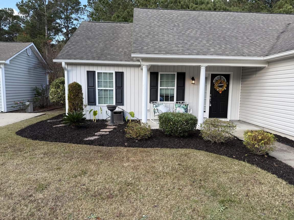 Mulched foundation bed along a front porch